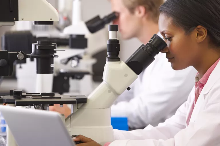 Lady in the lab microscope